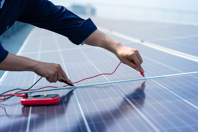 An engineer testing a Solar Panel